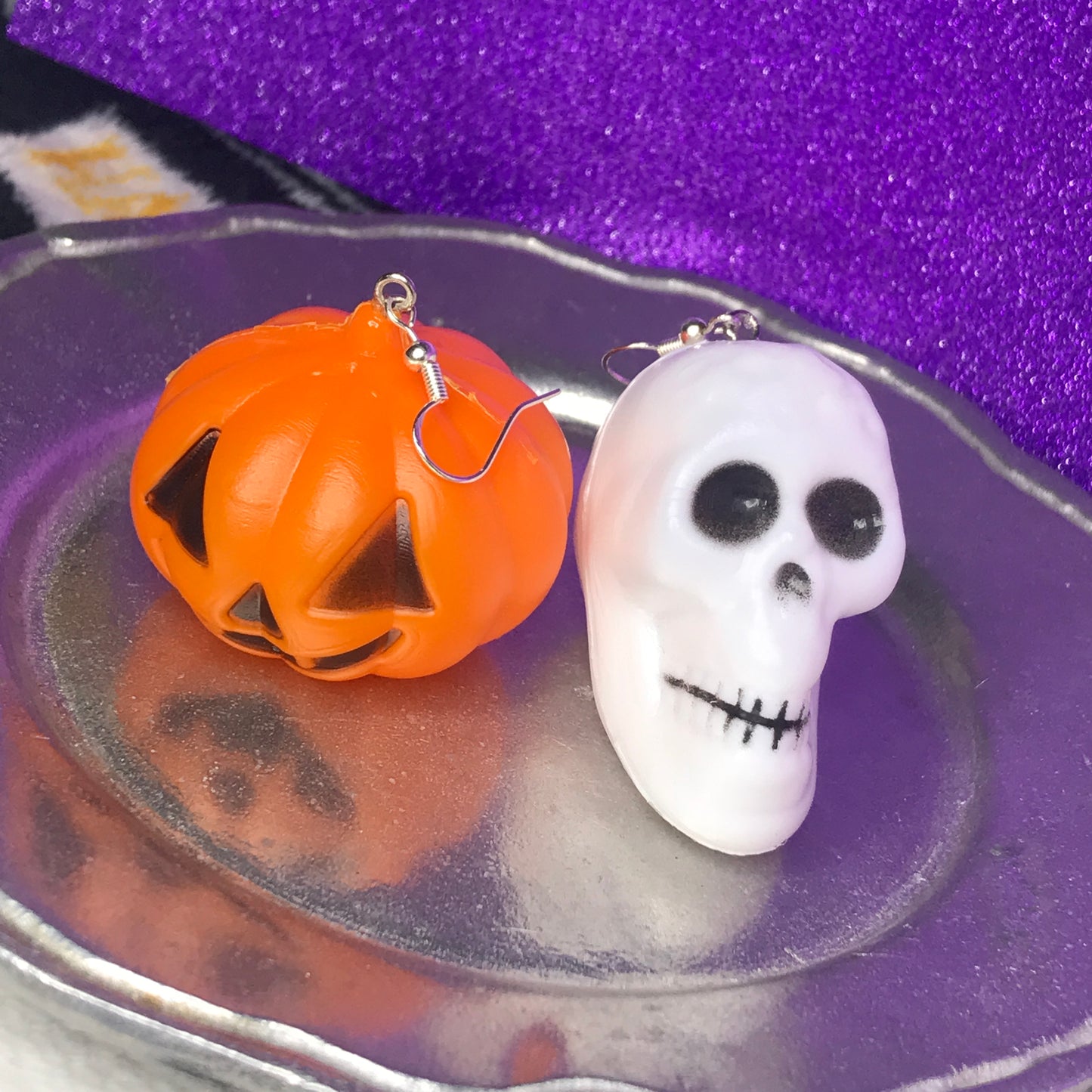 jack-o'-lantern and skull earrings