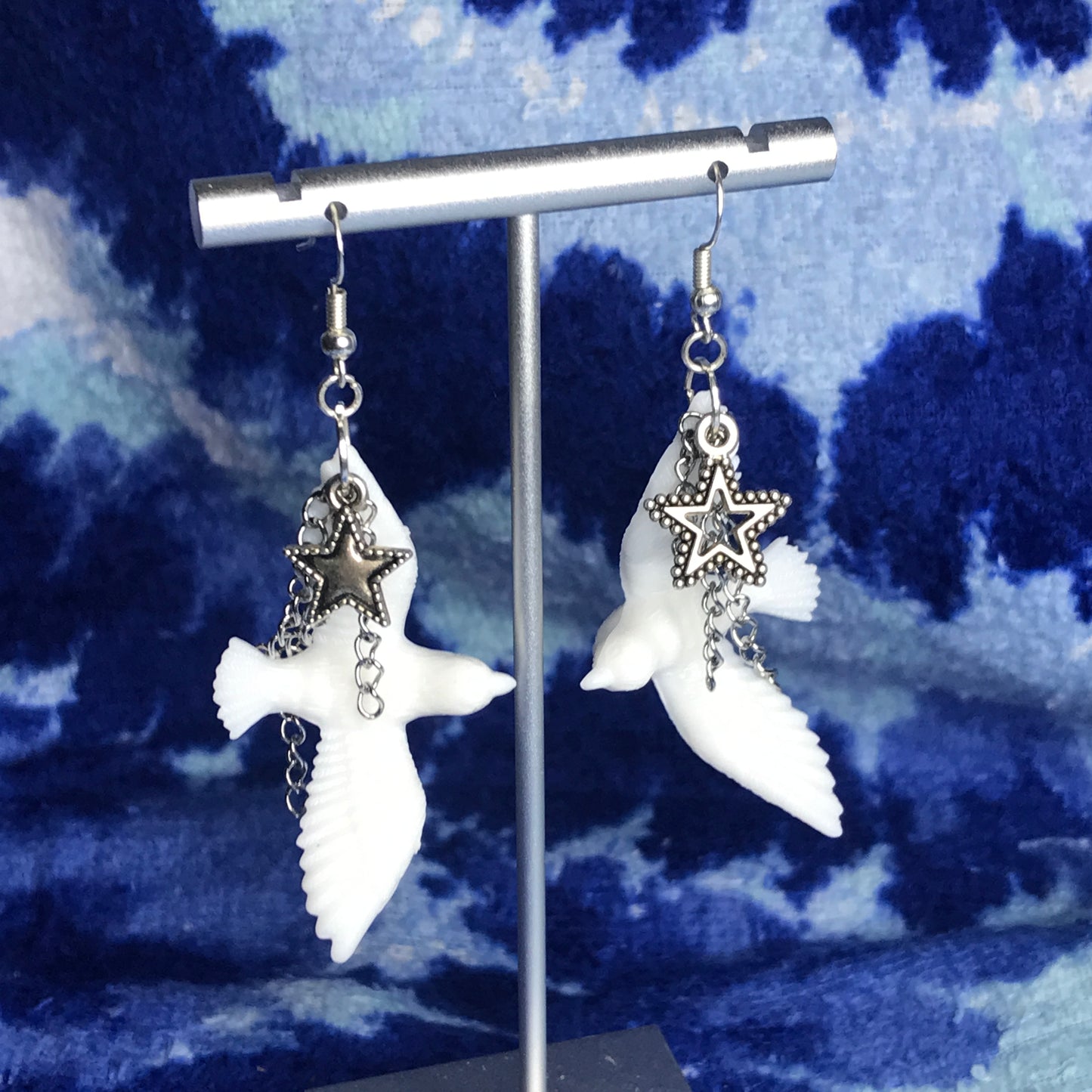 chained star dove earrings