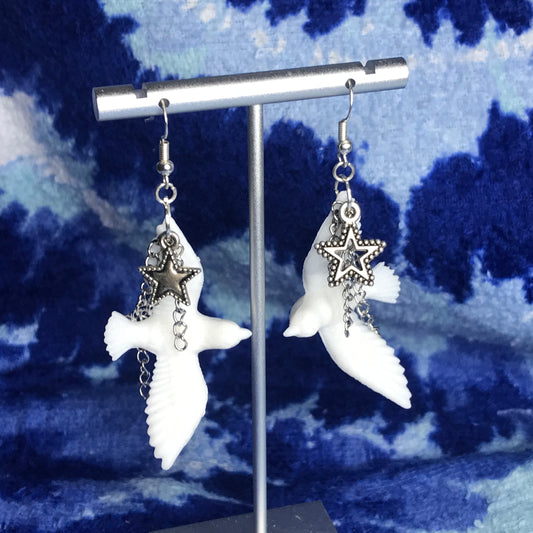 chained star dove earrings