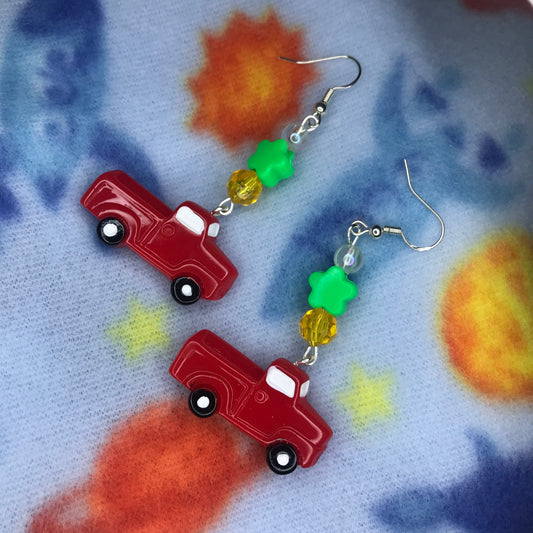 red truck with flower earrings